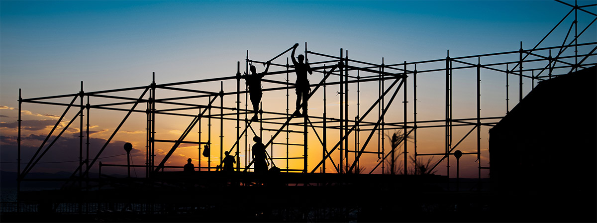 Construction Workers Erecting Scaffolding